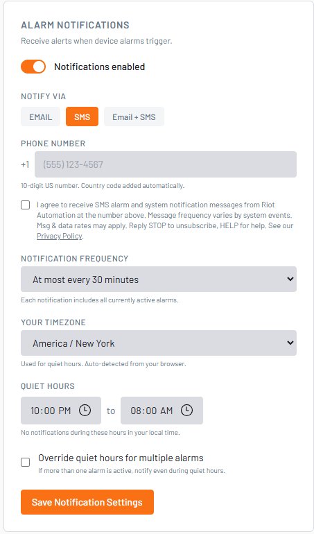Riot Automation notification settings screen showing the mobile number field and the SMS consent checkbox a user must check to receive text messages.
